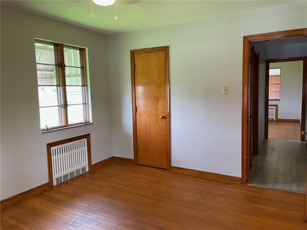 4517 Lincoln Avenue Jeannette, PA 15644 - Photo 24 of 37 an empty room with wooden floor and a window