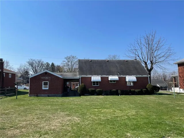 a view of a street with houses on both side
