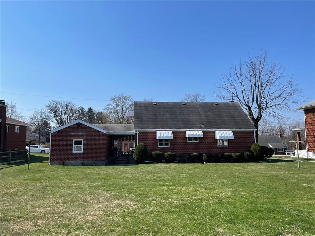 4517 Lincoln Avenue Jeannette, PA 15644 - Photo 35 of 37 a view of a house with a garden