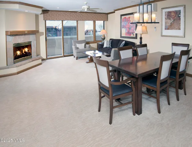 a living room with furniture and a kitchen
