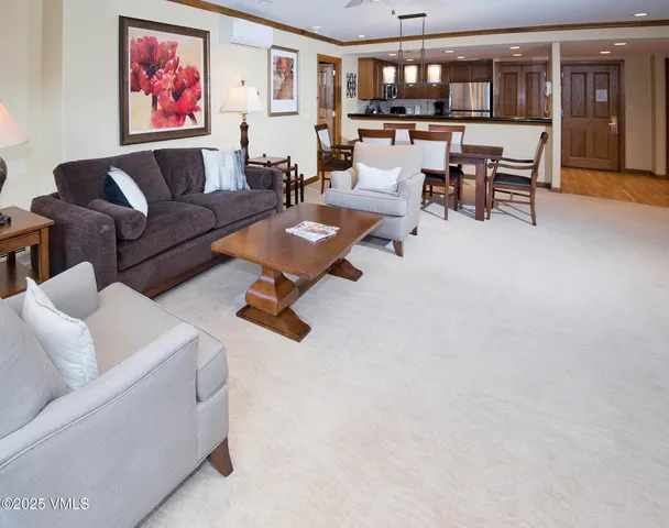 a view of a dining room with furniture window and a fireplace