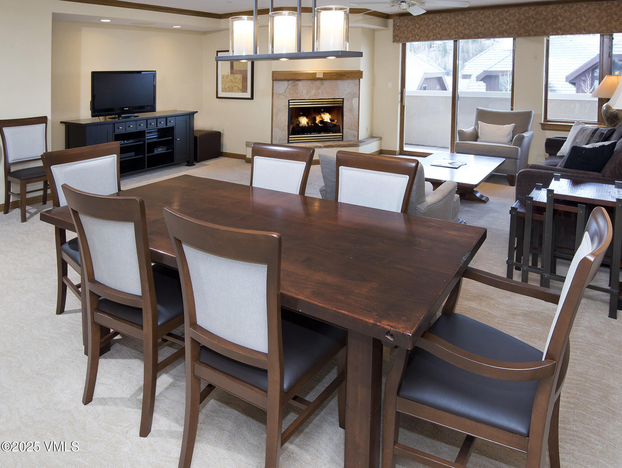 210 Offerson Road Beaver Creek, CO 81620 - Photo 18 of 30 a view of a dining room with furniture window and a fireplace