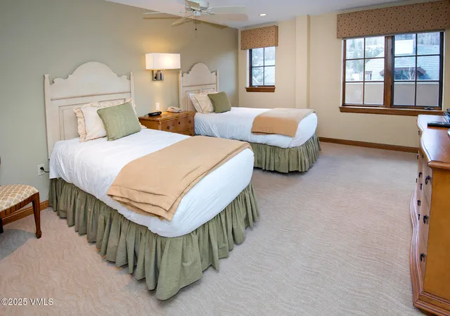 a bathroom with a granite countertop toilet a sink and a bathtub