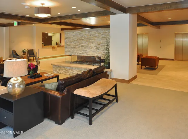 a lobby with a table and window