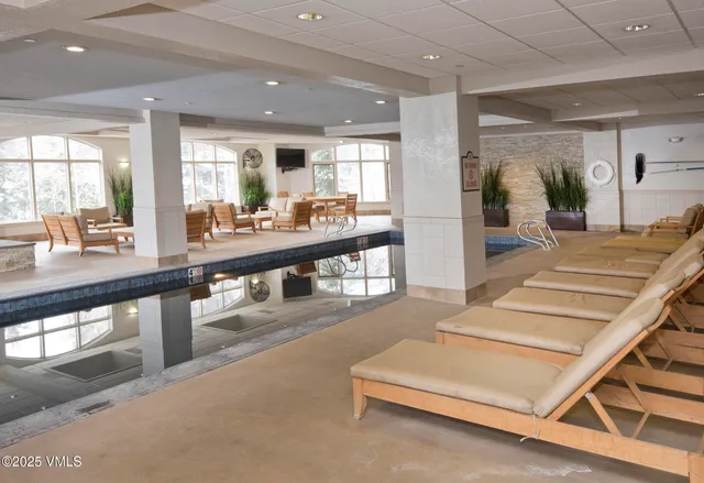 a view of swimming pool with a yard