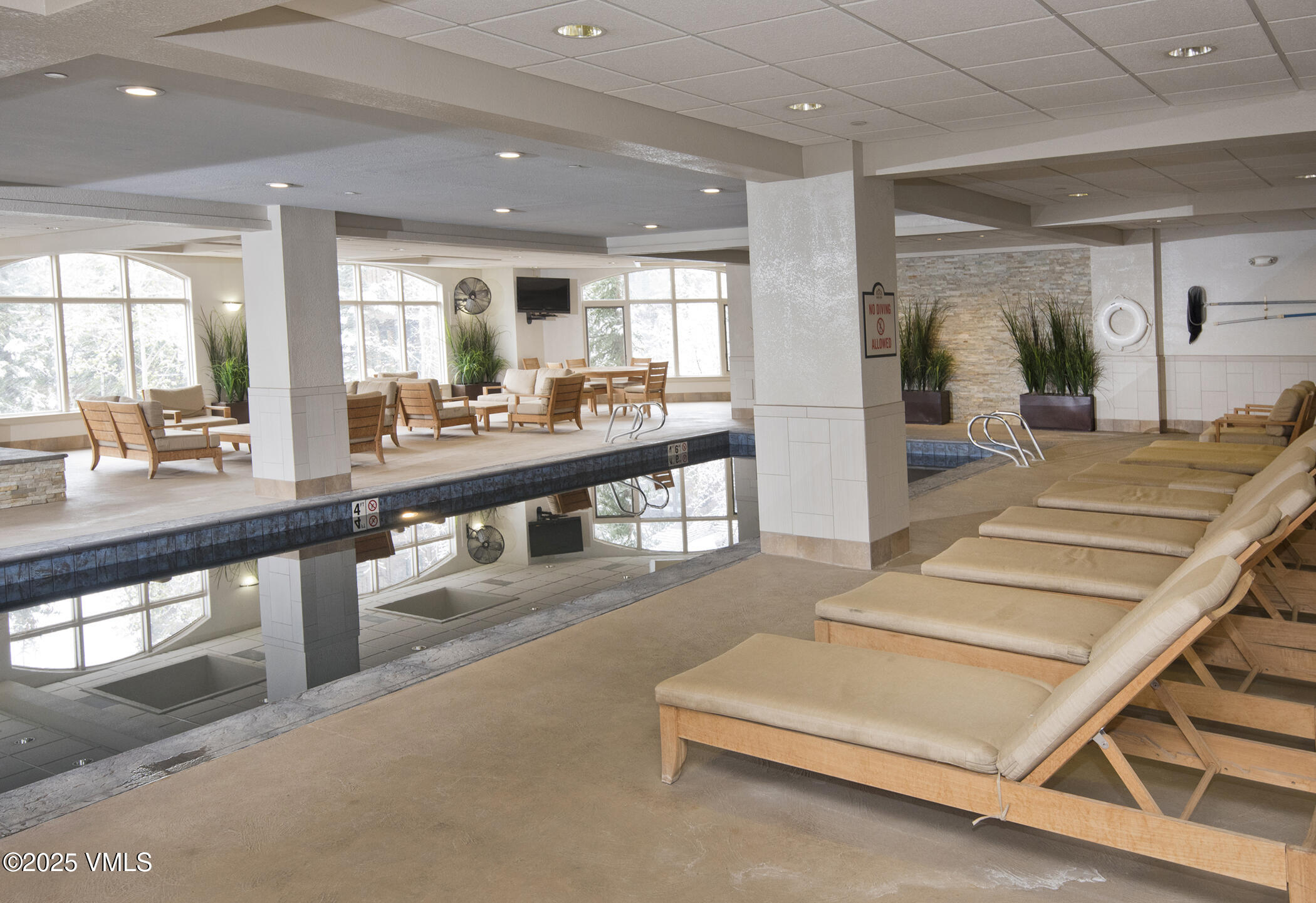 210 Offerson Road Beaver Creek, CO 81620 - Photo 8 of 30 a lobby with a table and window