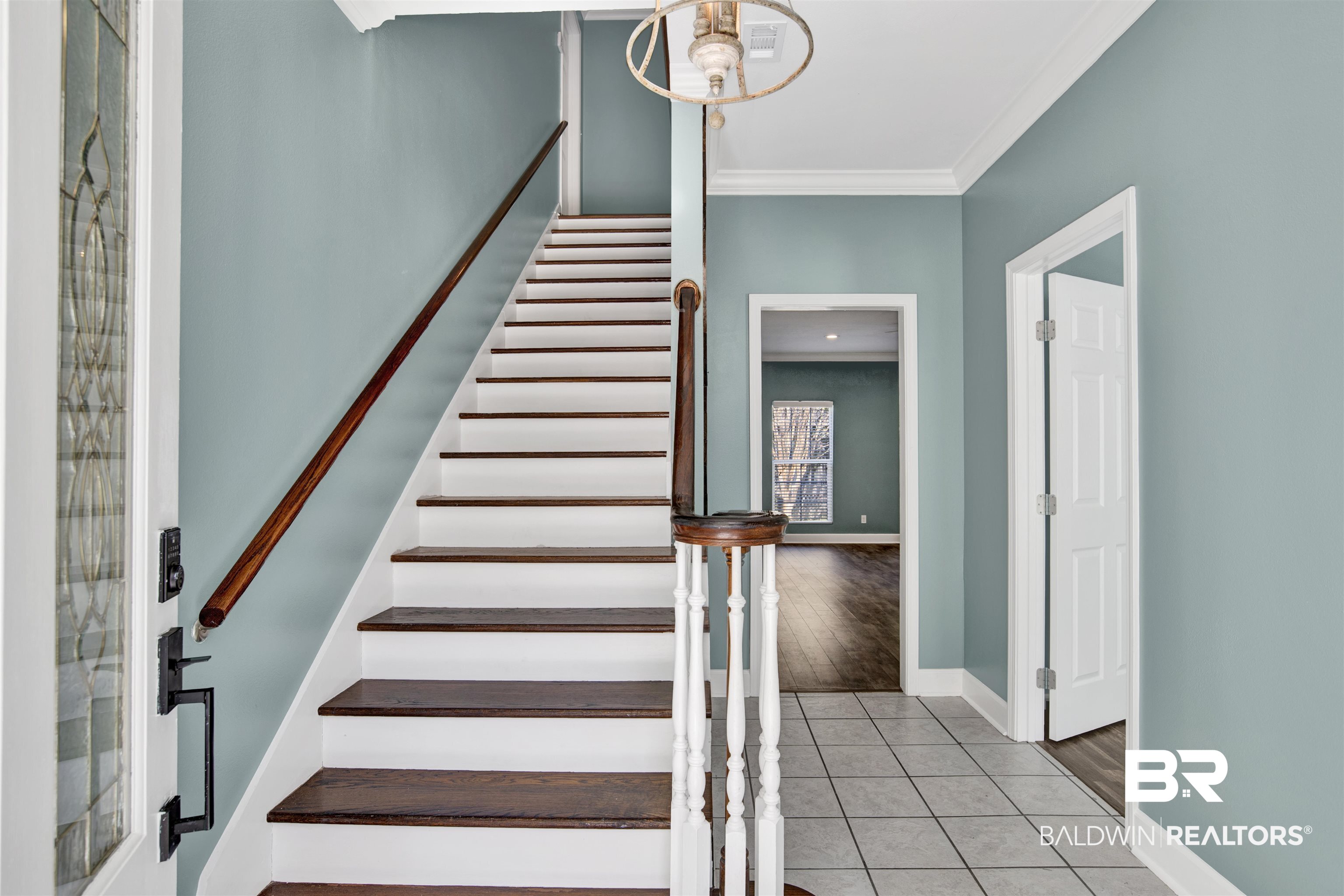 11835 Island Drive Foley, AL 36535 - Photo 24 of 53 Staircase with tile patterned floors and crown molding