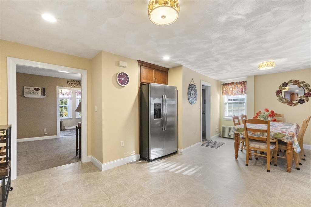 36 Forest Street Peabody, MA 01960 - Photo 13 of 35 a view of a livingroom with furniture and front door