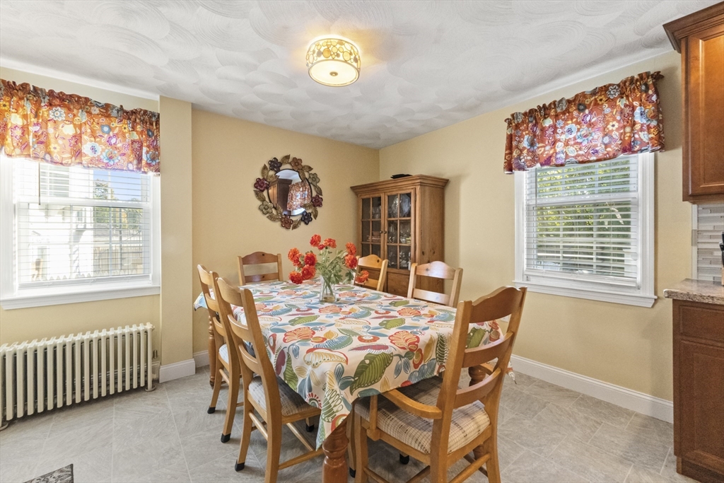36 Forest Street Peabody, MA 01960 - Photo 15 of 35 a view of a dining room with furniture and a window