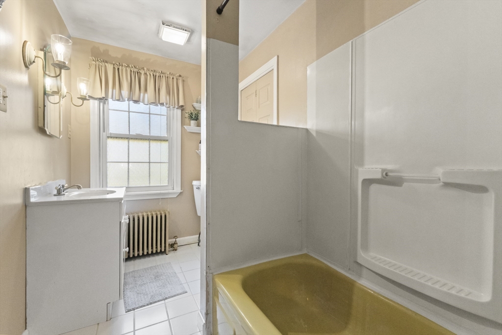 36 Forest Street Peabody, MA 01960 - Photo 16 of 35 a bathroom with a tub and shower