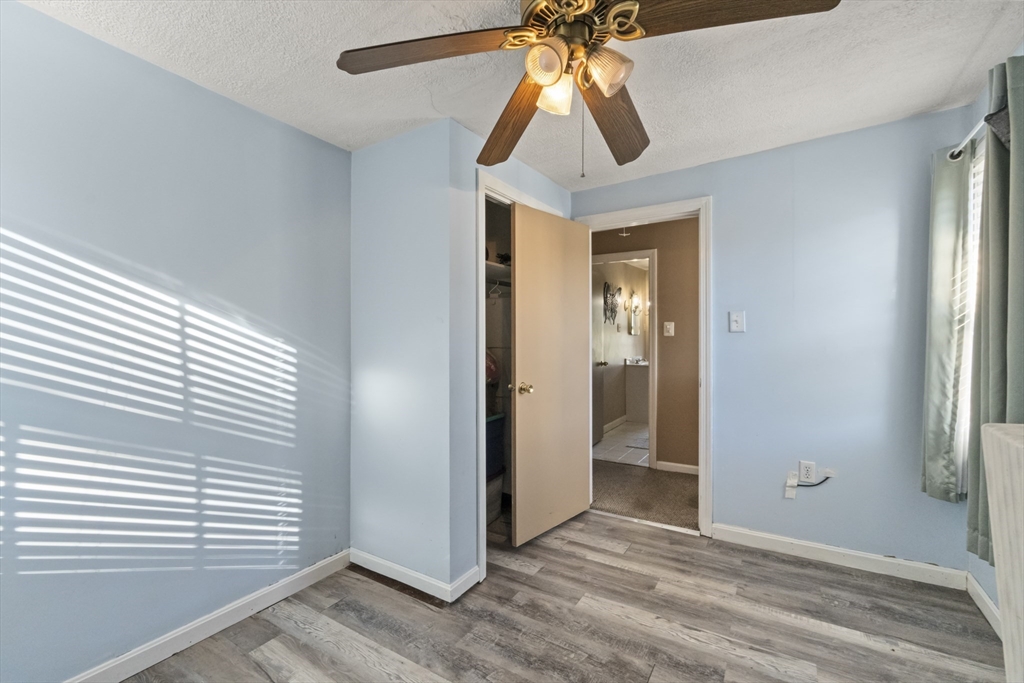 36 Forest Street Peabody, MA 01960 - Photo 25 of 35 wooden floor in an empty room with a window
