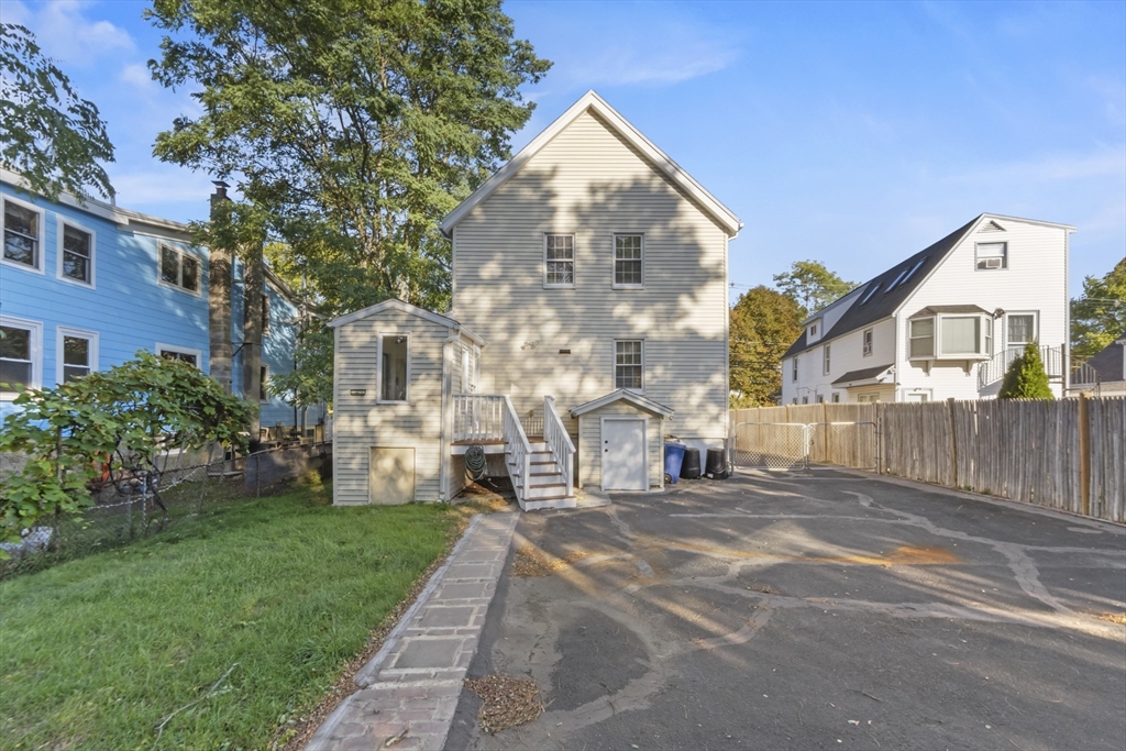 36 Forest Street Peabody, MA 01960 - Photo 26 of 35 a view of a building with a yard