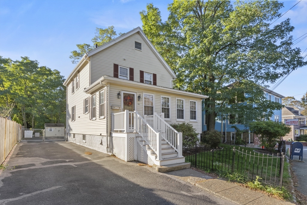 36 Forest Street Peabody, MA 01960 - Photo 30 of 35 a front view of a house with a yard table and chairs