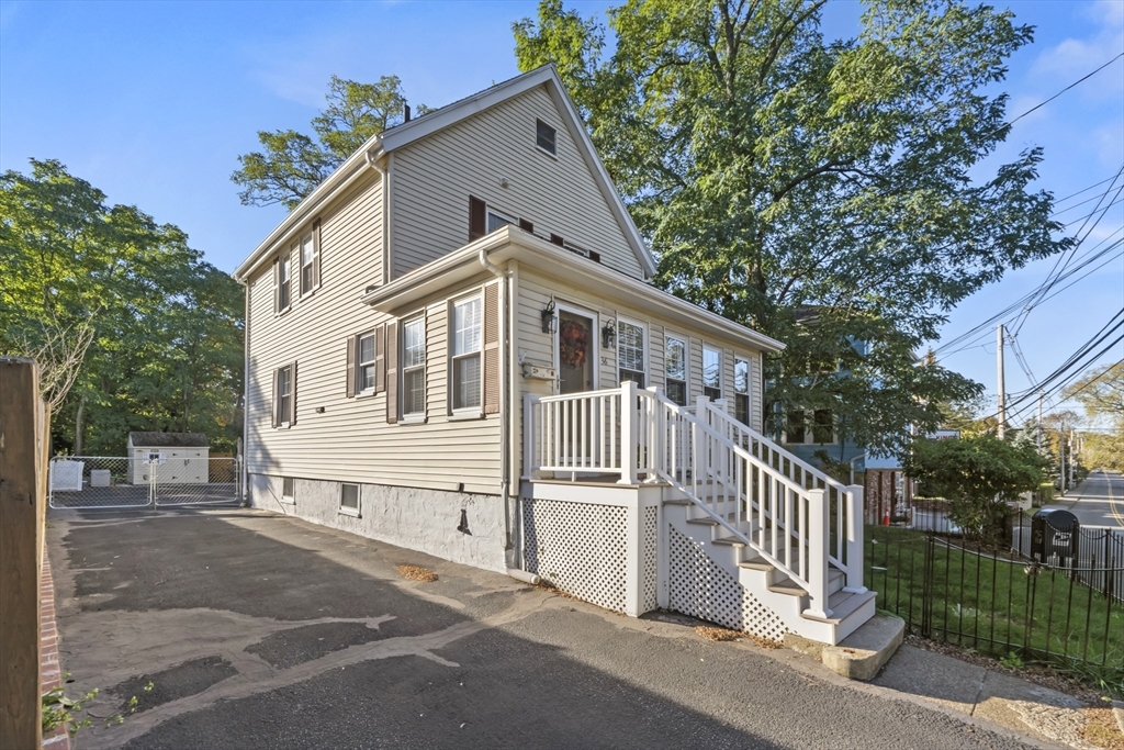 36 Forest Street Peabody, MA 01960 - Photo 31 of 35 a view of a house with a yard