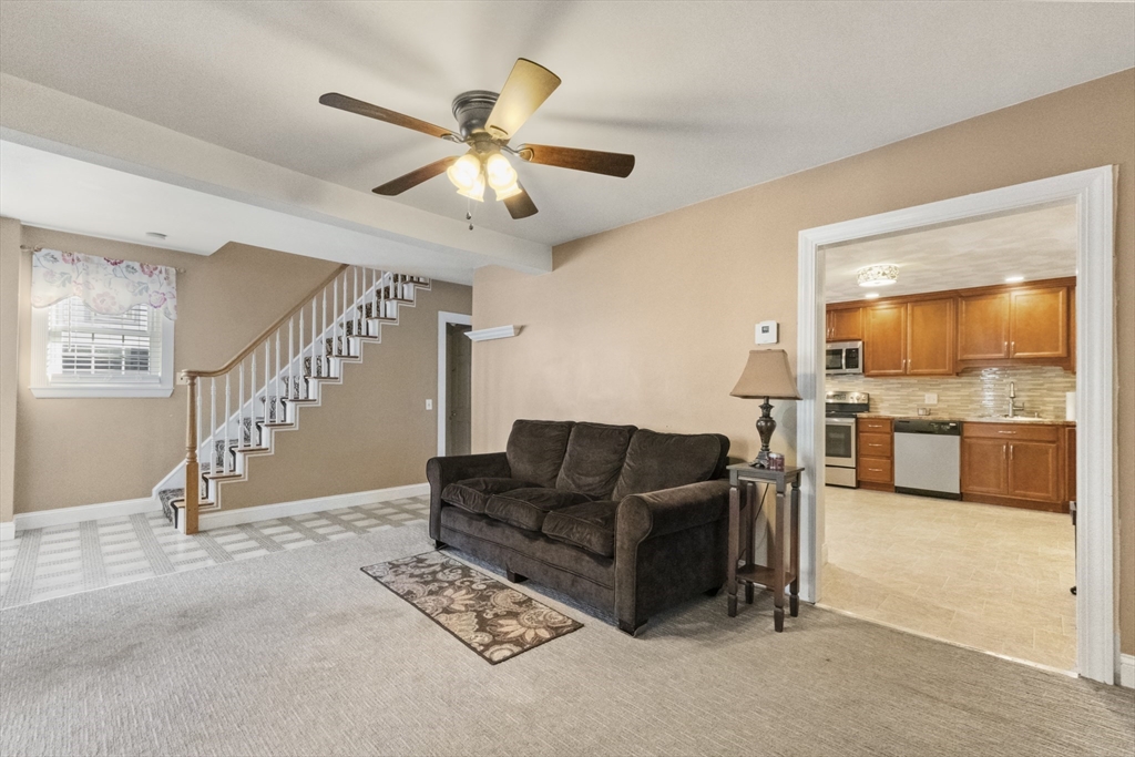 36 Forest Street Peabody, MA 01960 - Photo 5 of 35 a living room with furniture and kitchen view