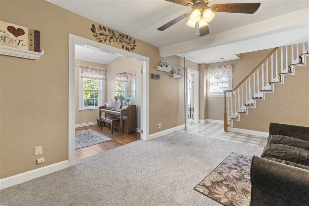 36 Forest Street Peabody, MA 01960 - Photo 7 of 35 a living room with furniture and a chandelier