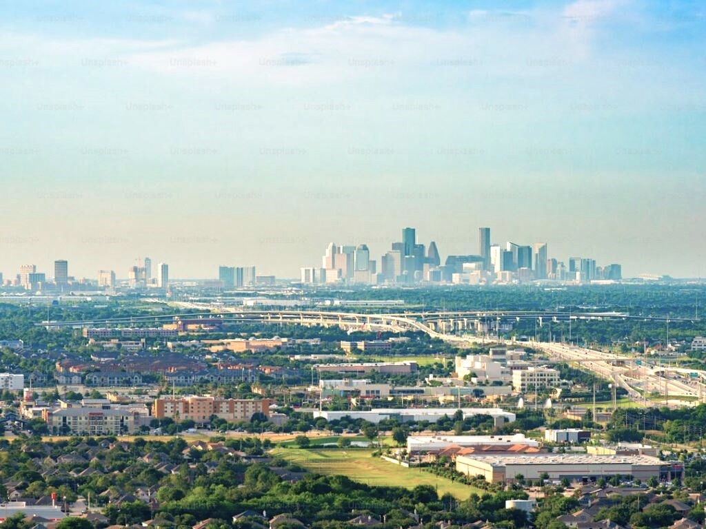 an view of a city with tall buildings in the background
