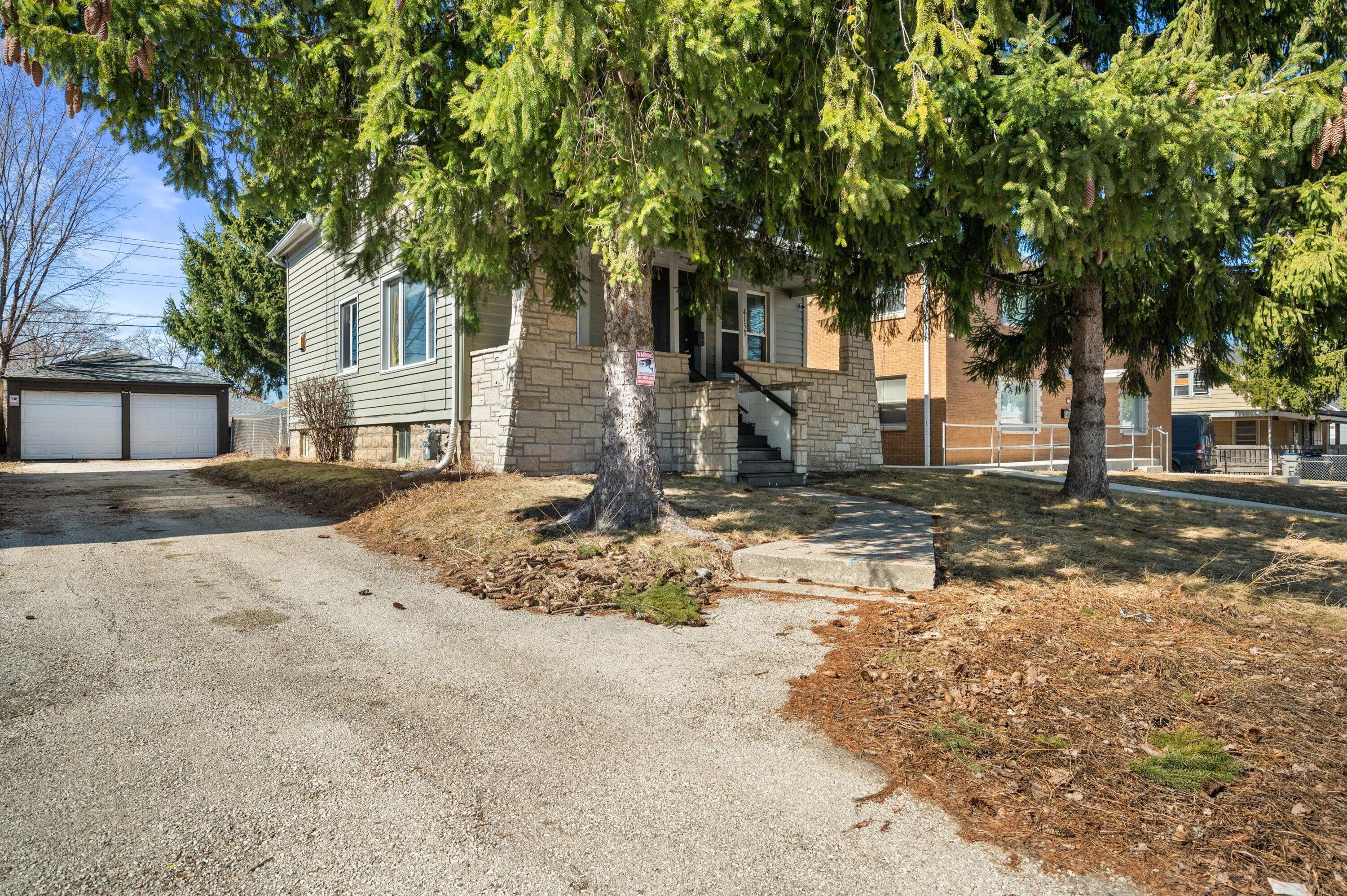 4153 North 60th Street Milwaukee, WI 53216 - Photo 1 of 1 Long driveway and 2 car garage