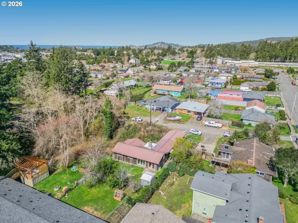an aerial view of residential houses with outdoor space