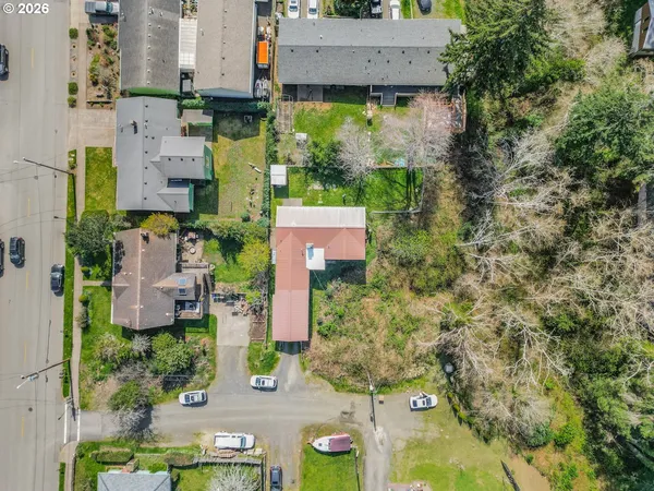 an aerial view of residential building and parking space