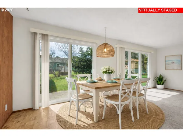 a view of a dining room with furniture window and outside view