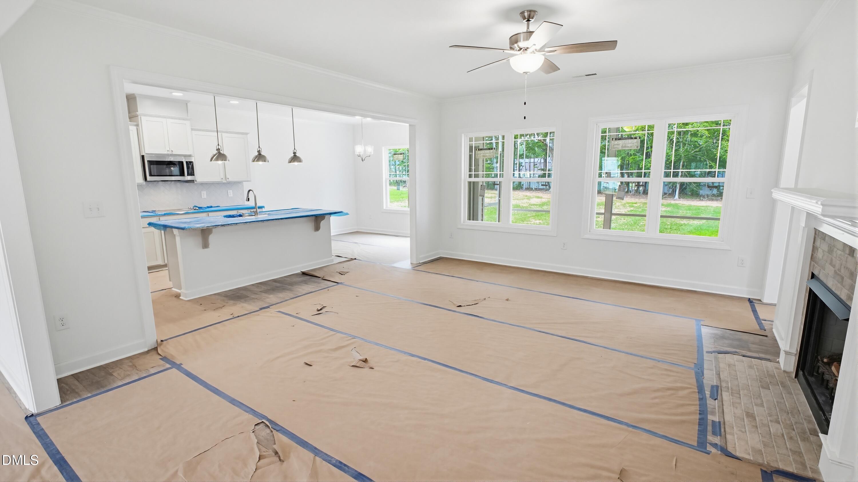 272 Seahawk Way Zebulon, NC 27597 - Photo 7 of 7 a kitchen with granite countertop white cabinets and white appliances