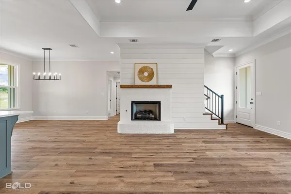 a view of a kitchen with a stove cabinets and wooden floor