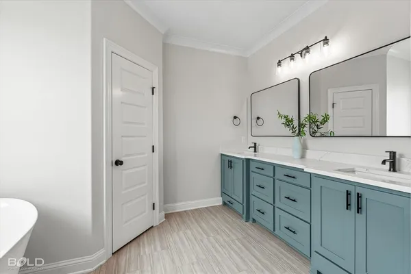 a white bath tub sitting in a bathroom