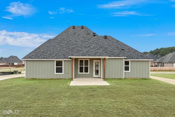 a view of a house with a backyard