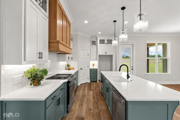 a kitchen with sink a counter and cabinets