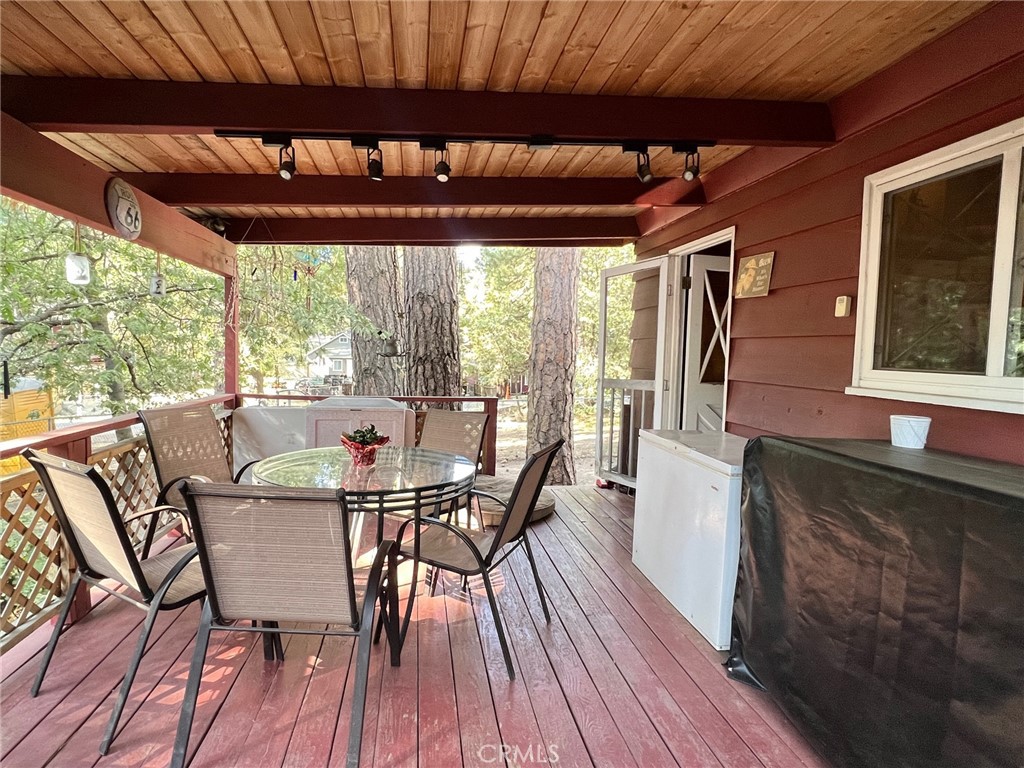 2551 Spring Drive Running Springs, CA 92382 - Photo 11 of 15 a dining room with furniture and wooden floor
