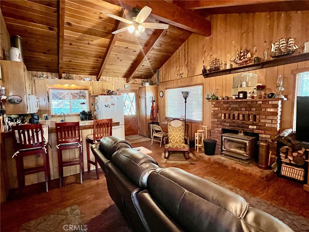 2551 Spring Drive Running Springs, CA 92382 - Photo 4 of 15 a living room with furniture and a flat screen tv