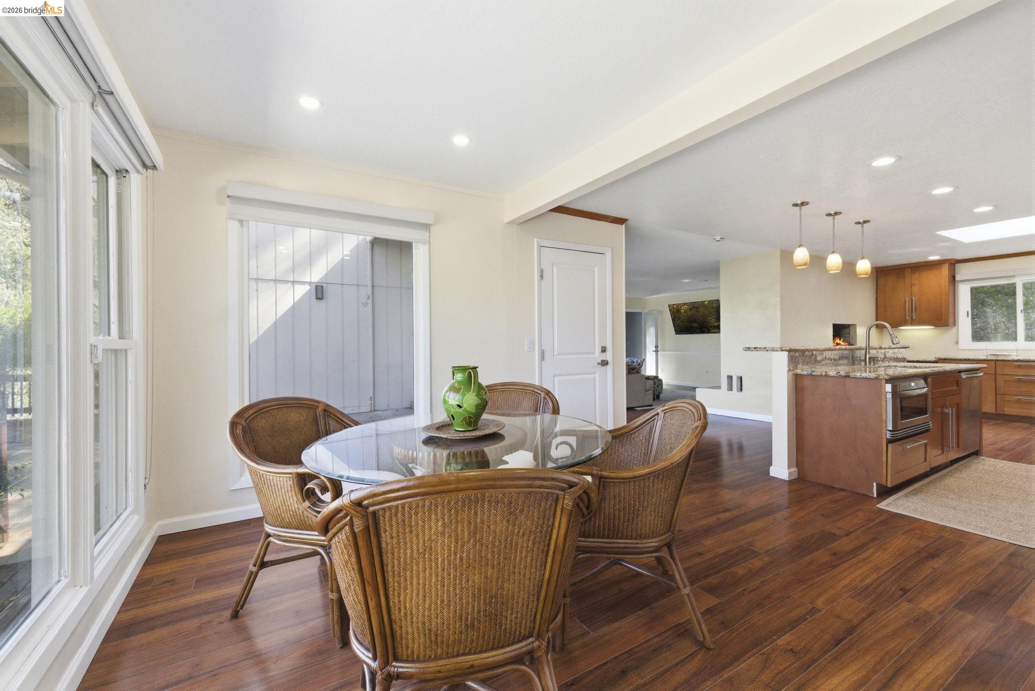 18389 Woodham Carne Road Sonora, CA 95370 - Photo 6 of 29 Dining room with dark wood finished floors, recessed lighting, and beam ceiling