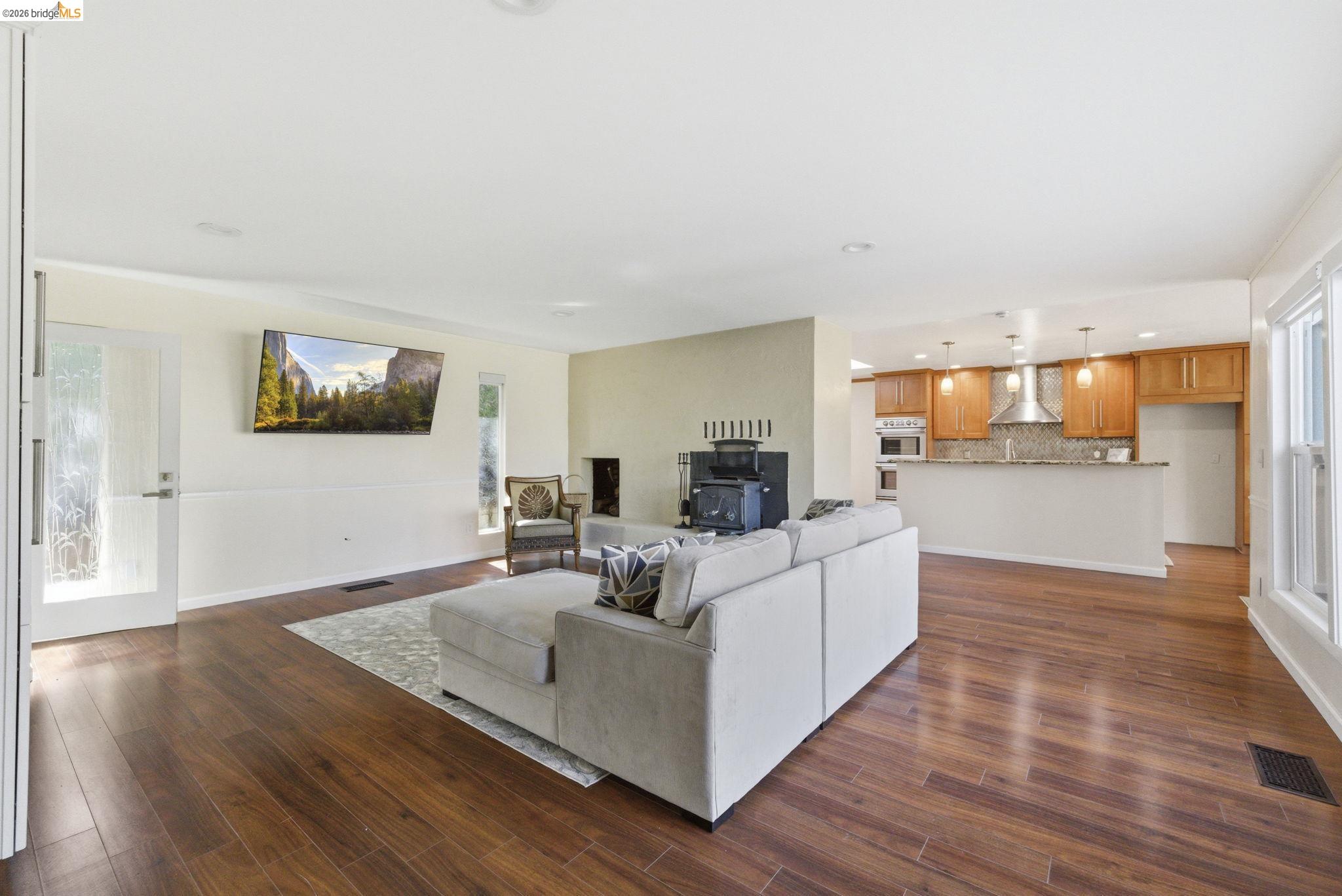 18389 Woodham Carne Road Sonora, CA 95370 - Photo 7 of 29 Living room with dark wood-style flooring and recessed lighting