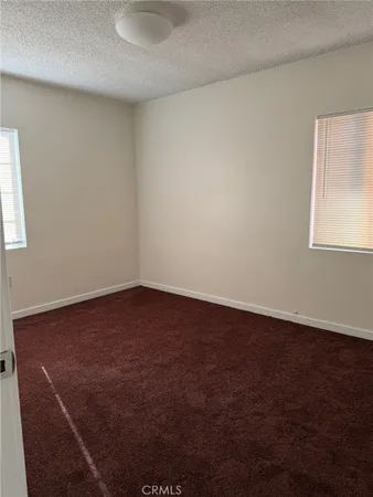 an empty room with a wooden door