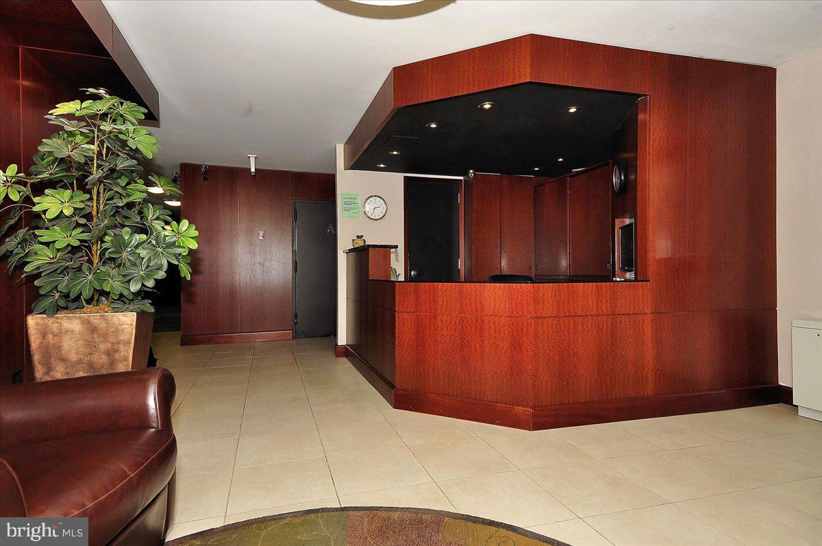 1260 21st Street Northwest, Unit 111 Washington, DC 20036 - Photo 20 of 33 Sleek modern reception area awaits guests.