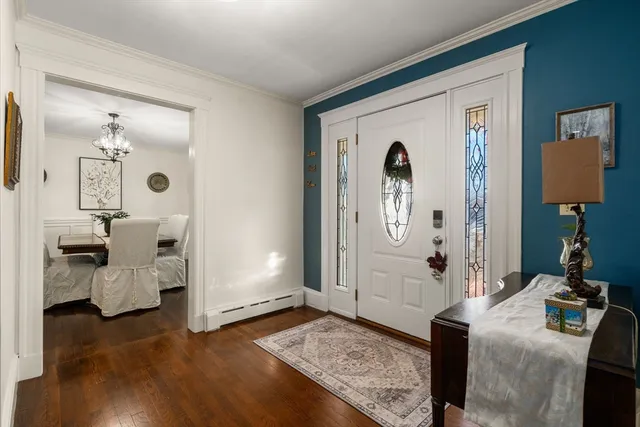 a living room with furniture and a mirror