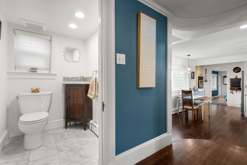 193 Garden Street Needham, MA 02492 - Photo 5 of 39 a bathroom with a toilet sink and a mirror