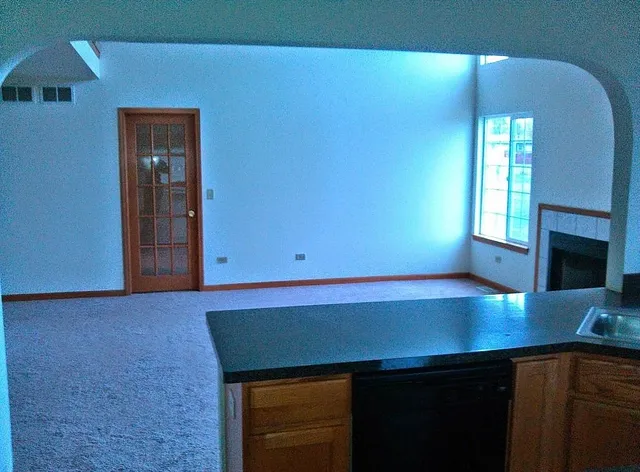 a room with a table and potted plants