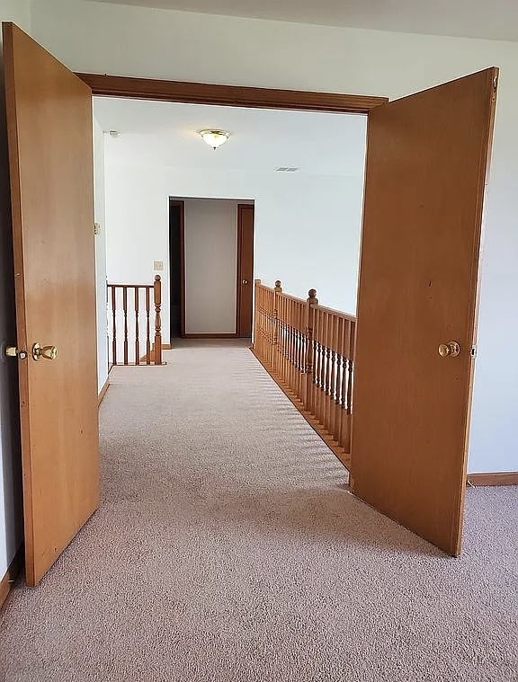 596 Farmview Court University Park, IL 60484 - Photo 13 of 14 a view of a hallway with staircase