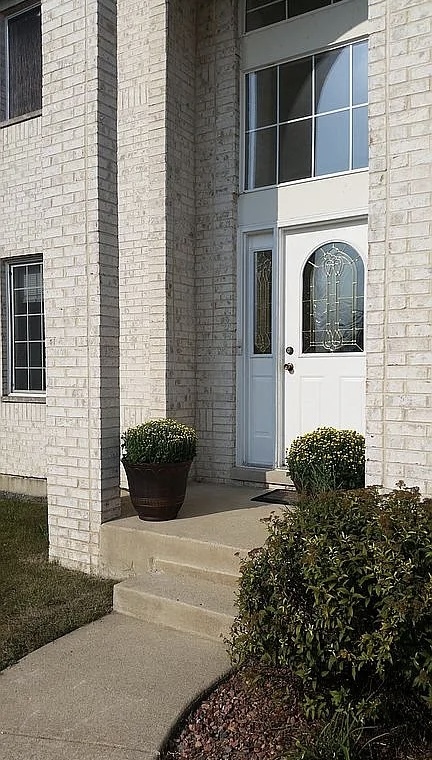 596 Farmview Court University Park, IL 60484 - Photo 3 of 14 a view of a house with potted plants