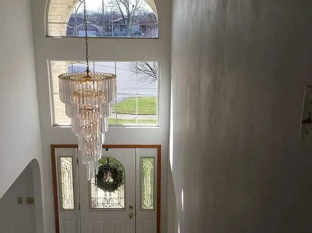 a room with a door open and a white door