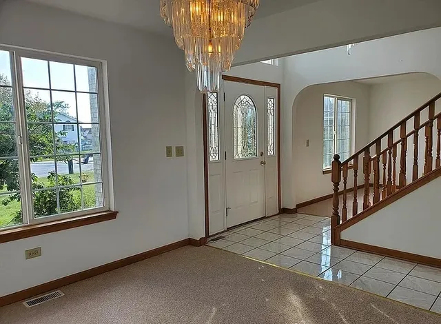 a view of a hallway with windows