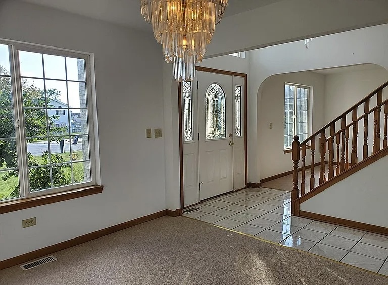 596 Farmview Court University Park, IL 60484 - Photo 6 of 14 a view of a hallway with windows