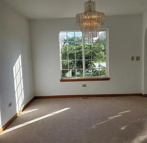 an empty room with windows and mountain view