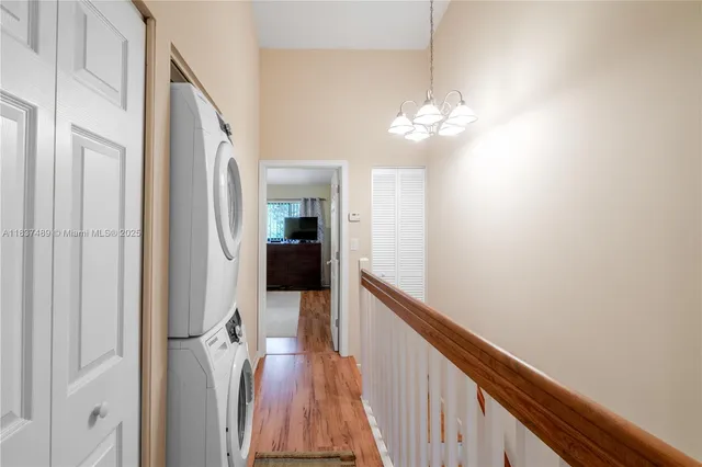 a view of a hallway with a chandelier