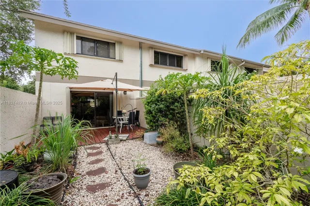 a view of a chair and table in the patio