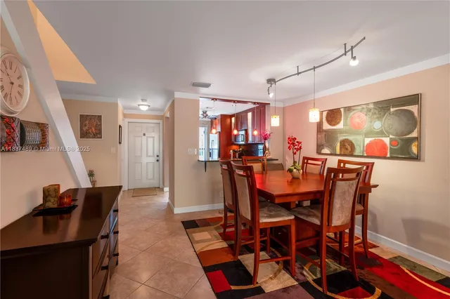 a view of a dining room with furniture and a rug