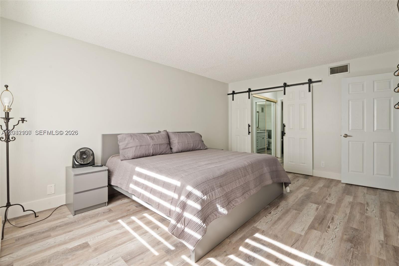 301 Racquet Club Road, Unit 104 Weston, FL 33326 - Photo 7 of 21 a bathroom with a bathtub and a shower