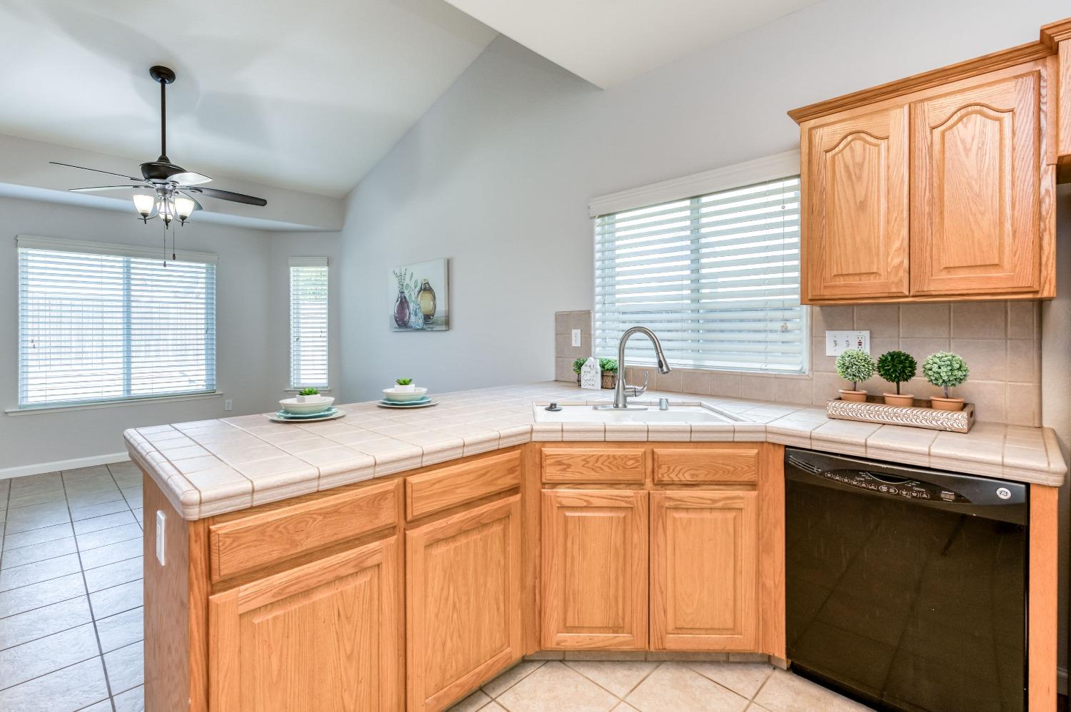 6580 East Raco Avenue Fresno, CA 93727 - Photo 14 of 30 a kitchen with a sink and cabinets